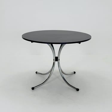 Mid-century dinning round table in chrome-plated steel with round solid black top, 1980s Italy 