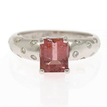 Turmaline and diamond ring set with an emerald-cut pink turmaline and numerous brilliant-cut diamonds 