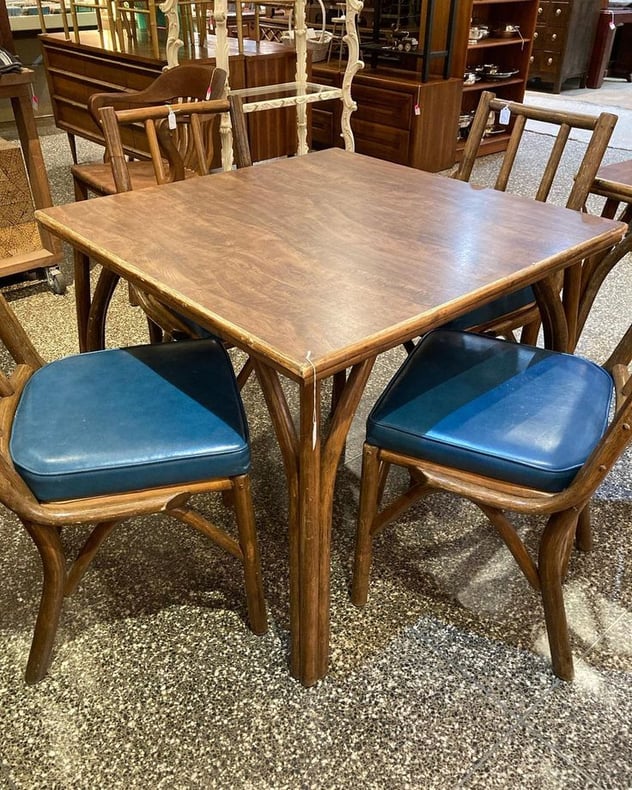 Laminate top rattan tables. Rattan and blue vinyl chairs Table
