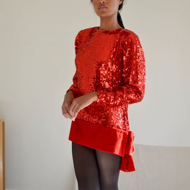 red sequined top with large velvet bow 