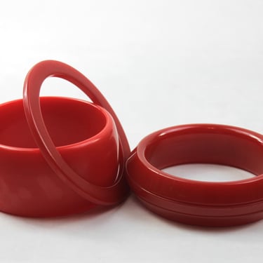 Bakelite Bangle Stack Set Cherry Red Wide Wall Slice and Carved Saucer 