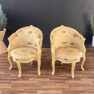 Pair of French Louis XVI Style Carved Chairs with an Antiqued Paint Finish 
