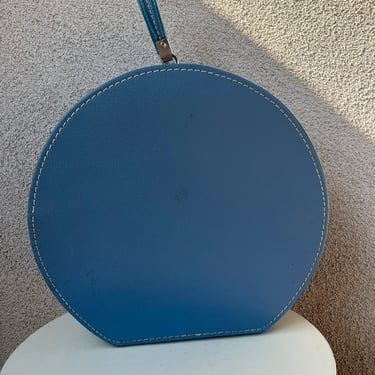 Vintage round large luggage baby blue vinyl handle by Travins  made in USA 