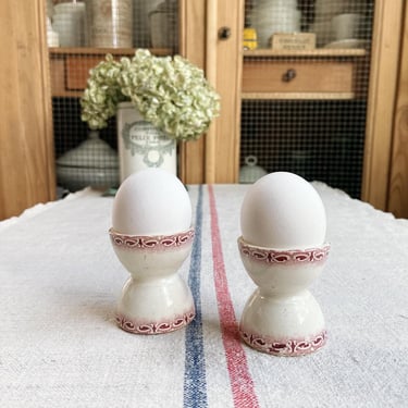 Beautiful vintage French ironstone egg cups in pinkish red 