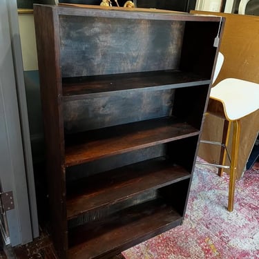Dark wood bookcase. 30” x 9.5” x 48” 