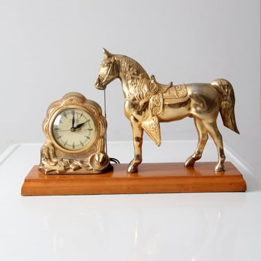 mid-century United self-starting horse clock 