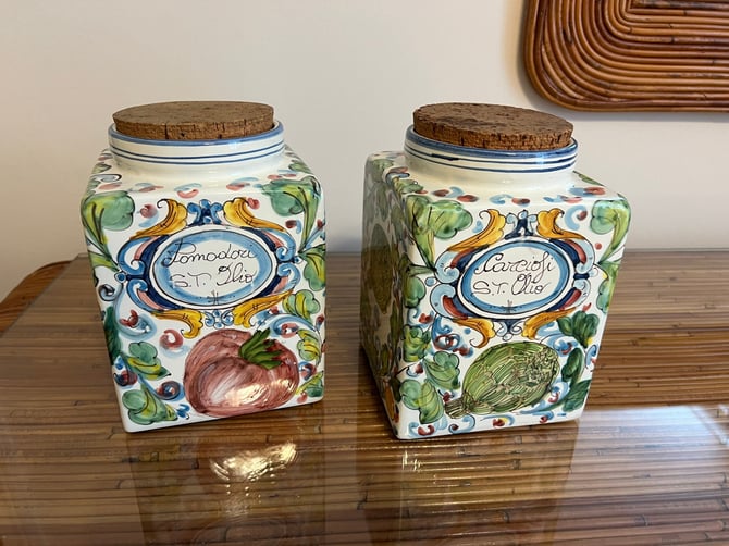 A pair of pretty hand painted Italian canisters with cork tops 