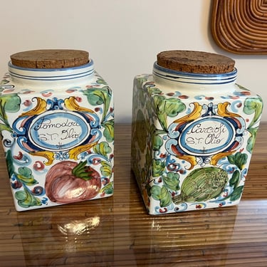 A pair of pretty hand painted Italian canisters with cork tops 