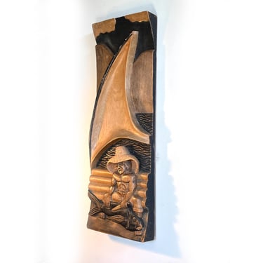 Large scale hand carved wall panel depicting a tropical scene with fisherman in sailboat 