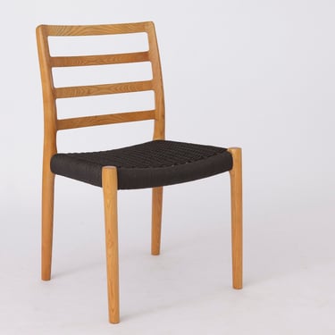 1 of 2 Niels Moller Mid century oak dining chairs with black papercord seat by Niels O. Møller for J.L. Moller, Model 85, Denmark 1980s 