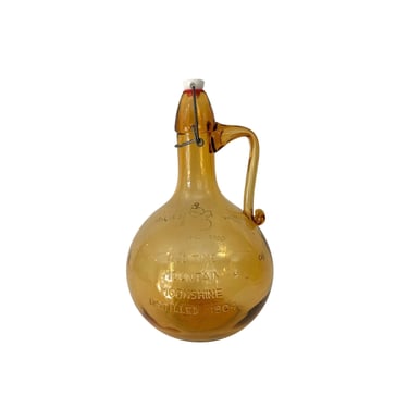 1969 Amber Glass Jug " Old Time Mountain Moonshine Distilled 1904" 