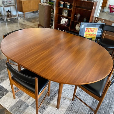 Mid Century Teak Round to Oval Dining Table with Four Teak Chairs by McIntosh
