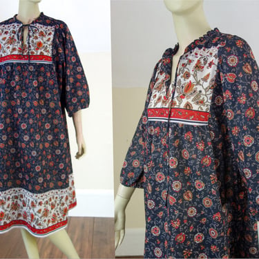80s muumuu or housedress size small to XL, puff sleeve & tie neck, maternity dress or volup kaftan in polyester paisley black floral pattern 