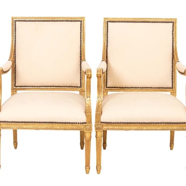 Pair of French Louis XVI style Gilt Arm Chairs