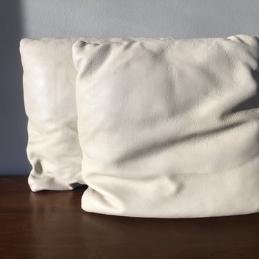 pair of leather throw pillows
