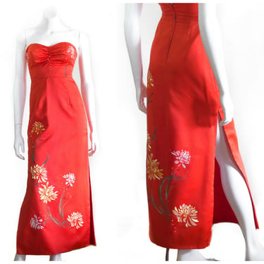 Red strapless dress with embroidered and painted flower decoration 