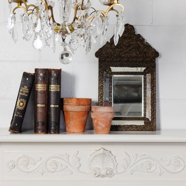 antique french repousse mirror with beveled glass