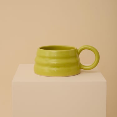 Chartreuse handmade ceramic mug with wiggly ripple shape 