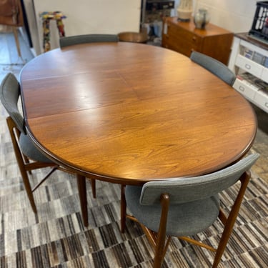 Mid Century Teak Round to Oval Dining Table with Butterfly Leaf &amp; Four Teak Dining Chairs Designed by Victor Wilkins for GPlan