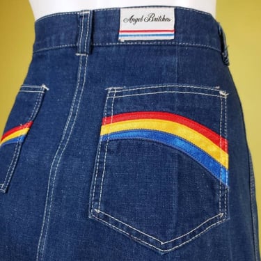 1970s denim rainbow skirt. Vintage jean skirt with patch pocket appliquès & back slit. Waist 30. 