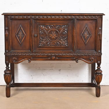 Baker Furniture Jacobean Carved Oak Sideboard Buffet or Bar Cabinet, Circa 1920s