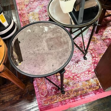Metal mirror top side tables. One gold-ish one black. Black table is 17” x 27” Gold-ish table is 17” x 26.5” Call 202-232-8171 to purchase either or both!