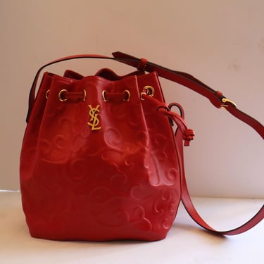 Yves Saint Laurent Vintage Arabesque Pattern Leather Bucket Bag with Gold YSL Logo 1990s Shoulder Crossbody 
