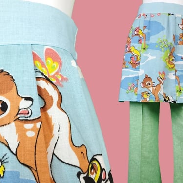 Deadstock vintage Bambi apron. Cotton/poly blend. 60s - 70s. Colorful cartoon graphic print. (OS) 