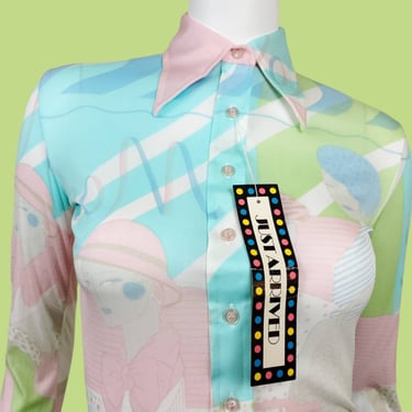 Novelty deco print blouse from the 70s. Deadstock vintage. Muted pastels, unique graphics, dagger collar, nylon, fitted, stretch. (S/XS) 