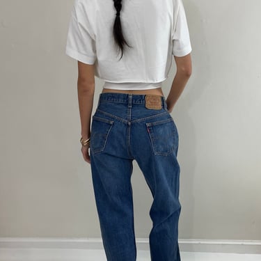 vintage Levi's 501 0115 medium wash button fly tall boyfriend jeans made in USA size 33 x 34