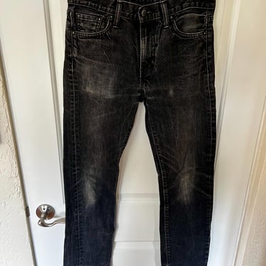 Faded vintage black Levi’s 518 5-pocket style jeans 