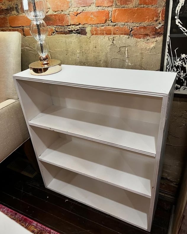 Smaller white painted bookcase. 30” x 9.5” x 33.5” 