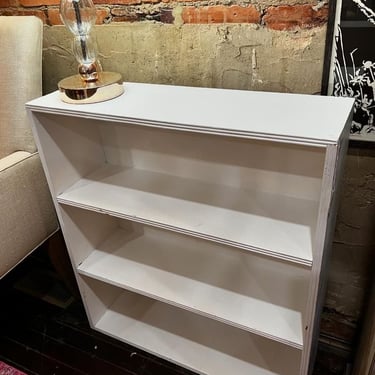 Smaller white painted bookcase. 30” x 9.5” x 33.5” 