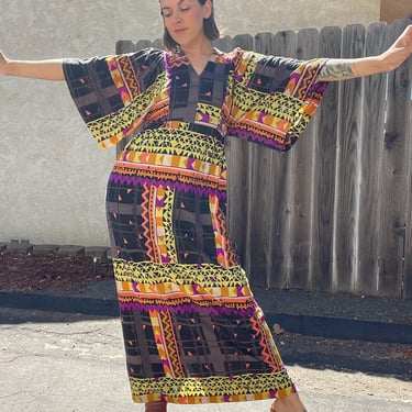 1970s neon and black geometric maxi dress with big ol sleeves and a waist tie 