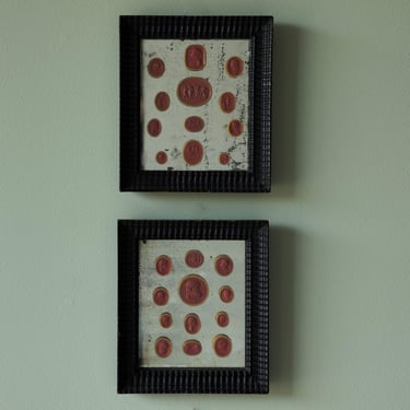 Collection of 17th C.  Swedish Red Wax Intaglios in Pair of Black Decorative Frames