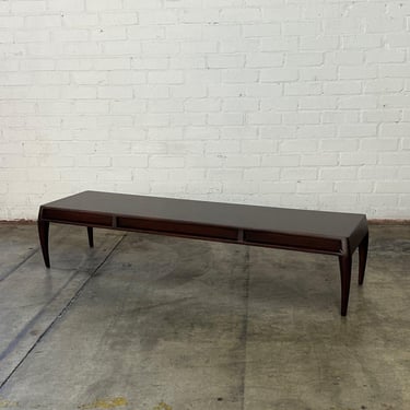 Low profile sculptural coffee table 