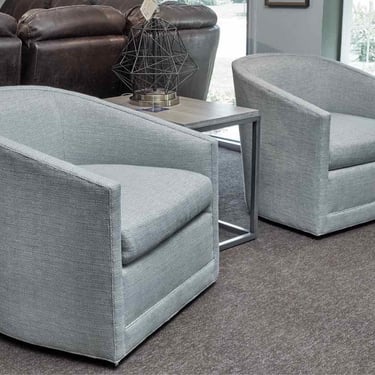 Pair Of Blue Textured Upholstered Swivel Chairs