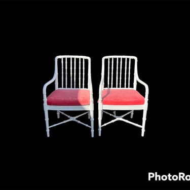 A pair of vintage faux bamboo arm chairs. 