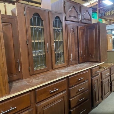 12 Piece Set of Stained Brown Kitchen Cabinets by KraftMaid with Bar Pulls