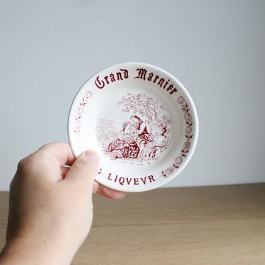 Vintage mid century Grand Marnier Liqueur small advertising plate, made for French bistros, with a burgundy courting couple decor 