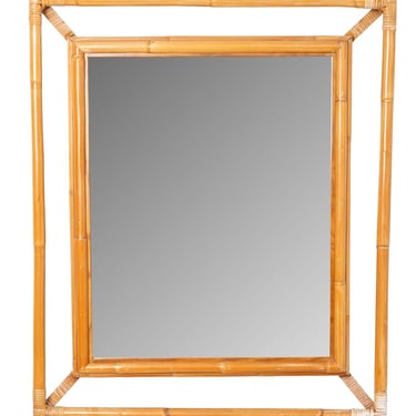A vintage bamboo and rattan mirror