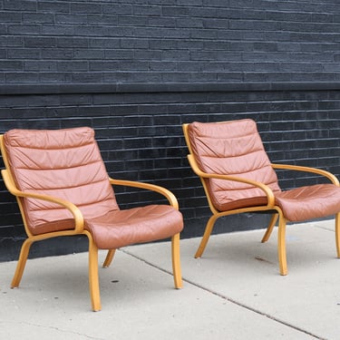 Pair of Scandinavian cognac leather lounge chairs 