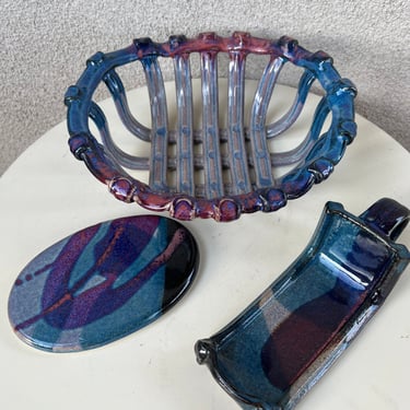 Vintage pottery purple blue glaze set bread basket trivet disc and wine bottle holder by Petteford 