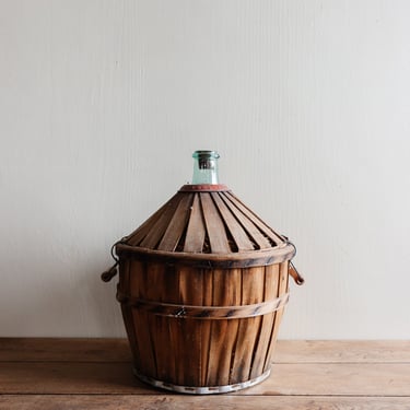 vintage French demijohn with wood strapping
