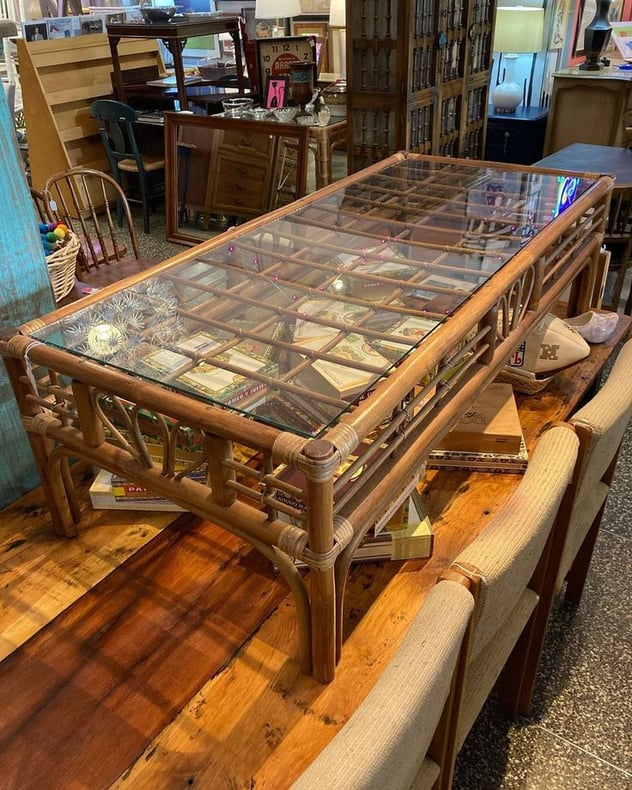 Glass top rattan coffee table 23.5” x 52.5” x 15.5” Call 202-232-8171 to purchase