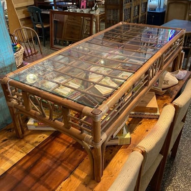 Glass top rattan coffee table 23.5” x 52.5” x 15.5” Call 202-232-8171 to purchase