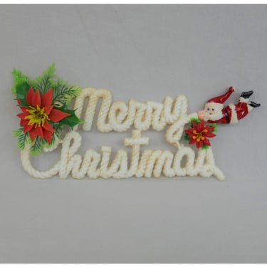 Vintage Merry Christmas Sign - Flexible Vinyl Plastic - Glittery White w/ Red Poinsettia and Flying Santa Claus 