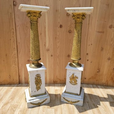 Antique French Empire Heavy Gold-Gilded Brass Corinthian Columned and Figural Ormolu Mounted White Carrara Marble Pedestals - Pair
