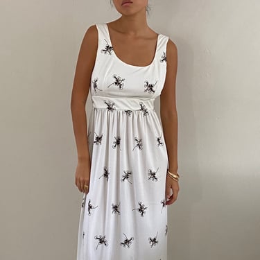 70s maxi dress / vintage white polyester jersey babydoll empire border print sleeveless maxi hostess dress | Medium 