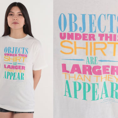 Funny T-Shirt 90s Objects Under This Shirt are Larger Than They Appear Graphic Tee Boob Joke TShirt Single Stitch White Vintage 1990s Small 